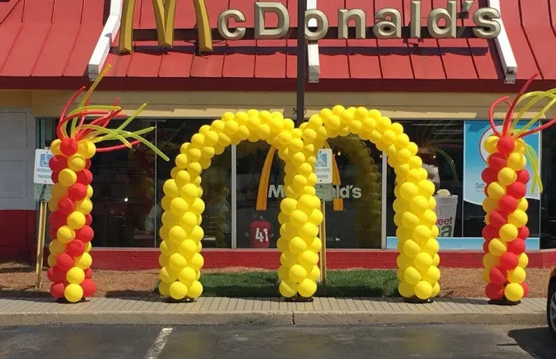 balloon arch McDonald's golden arches and red and yellow balloon columns