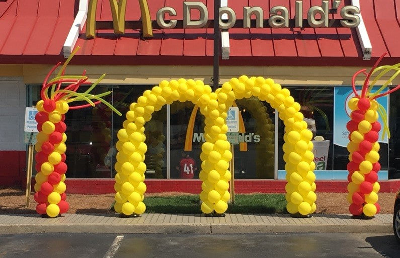 balloon arch McDonald's golden arches and red and yellow balloon columns