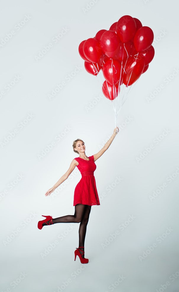 balloon bouquet with red balloons and lady holding them