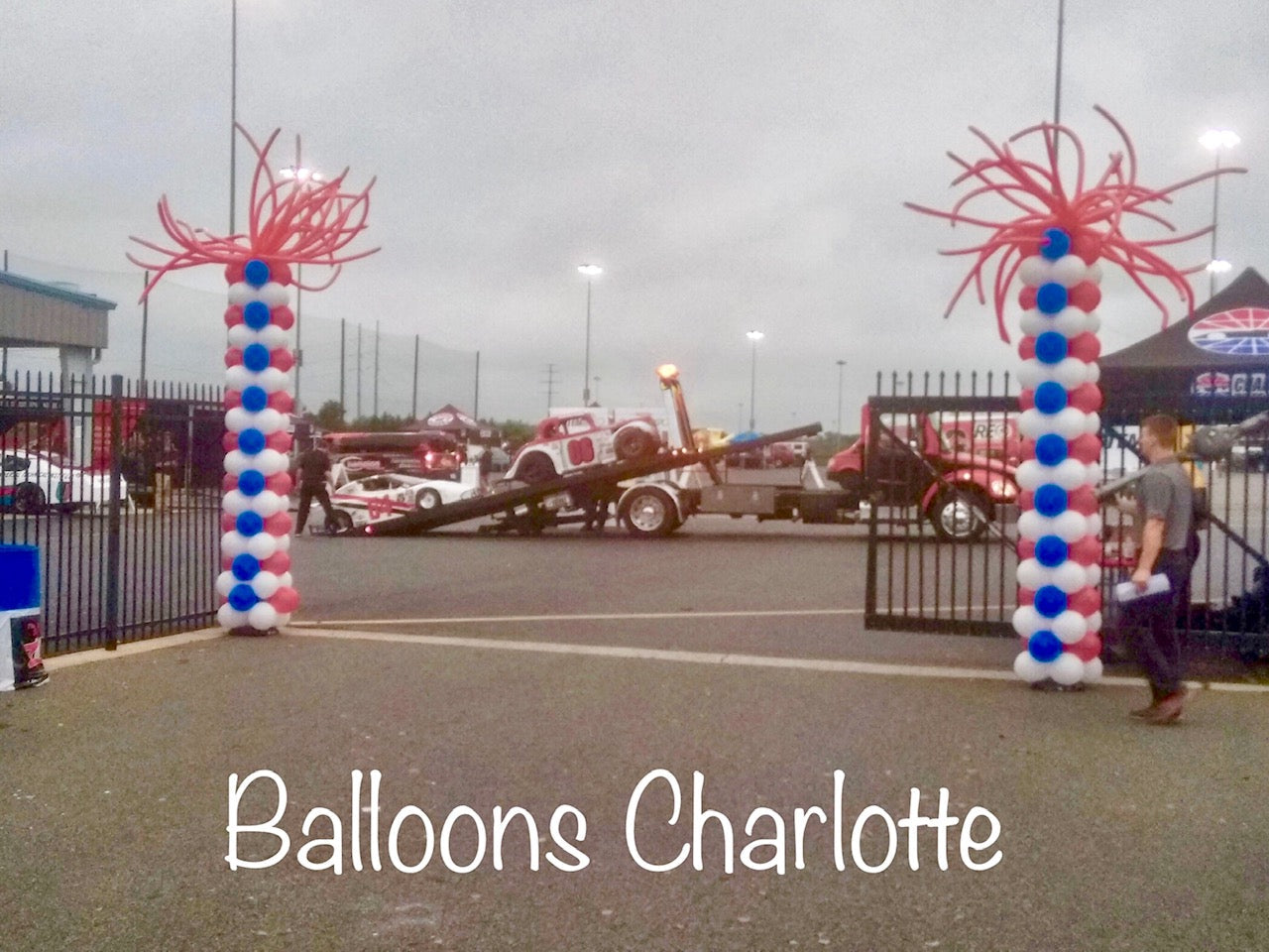 Balloon Columns red, white and blue at race track with red Spider Topper