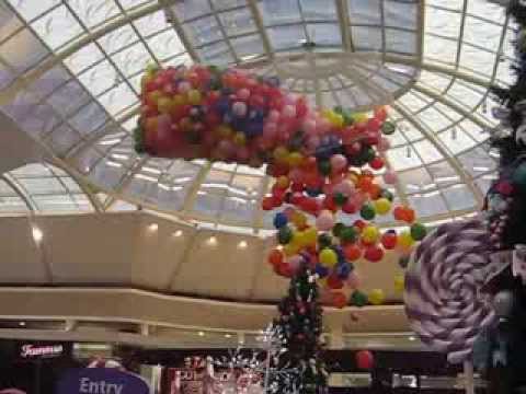 Balloon Drop ceiling balloon release from net with multi-colored balloons