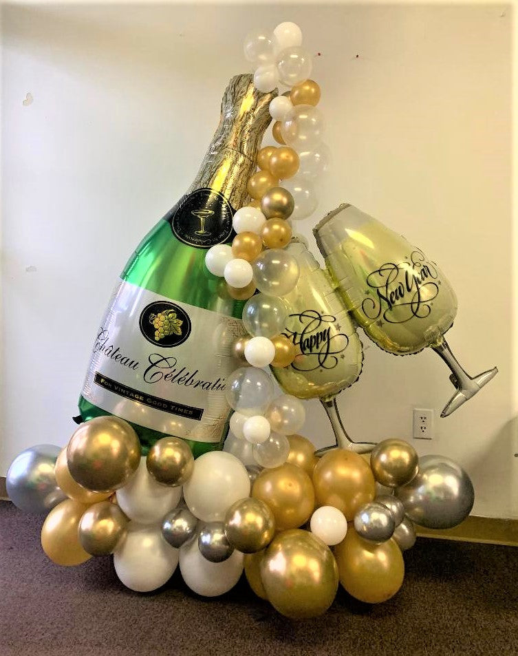 balloon bouquet with extra large champagne bottle. and a pair of champagne glasses