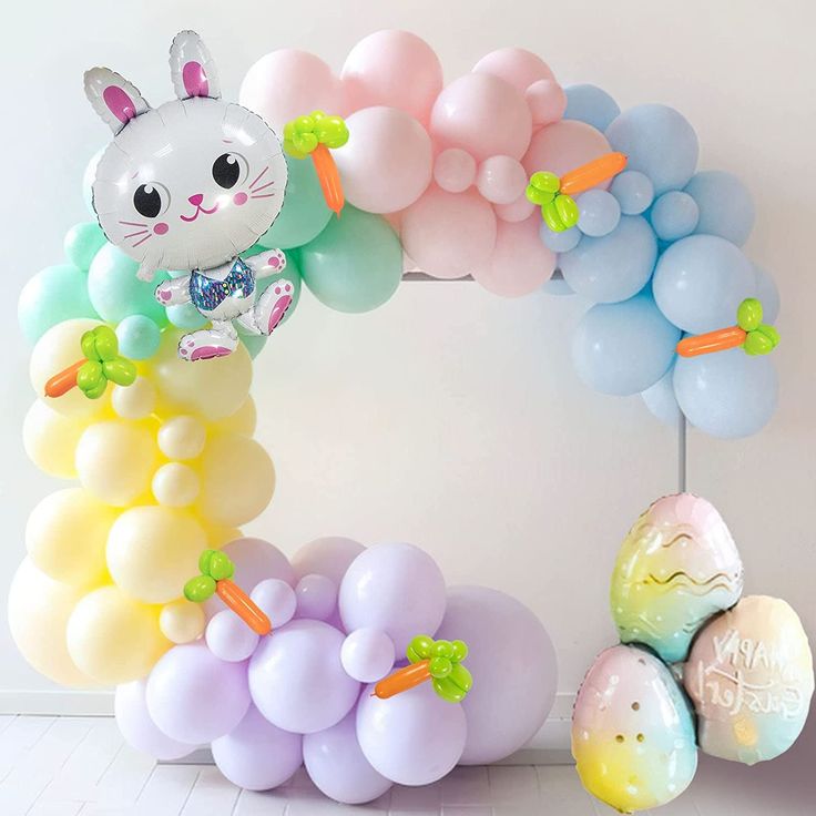 Easter circle balloon arch garland with pastel colors and bunny mylar balloon accents and balloon sculptured carrots