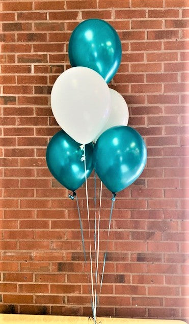 a balloon bouquet with 5 helium filled party balloons arranged as a centerpiece for table top balloon decorations is green and white