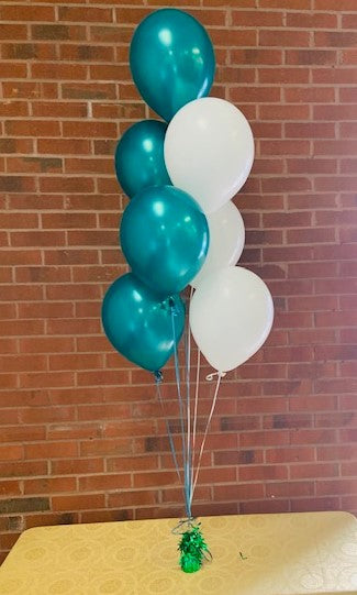 a helium balloon centerpiece consisting of 7 helium party balloons with ribbon and a weight to make a party balloon bouquet for a table top centerpiece