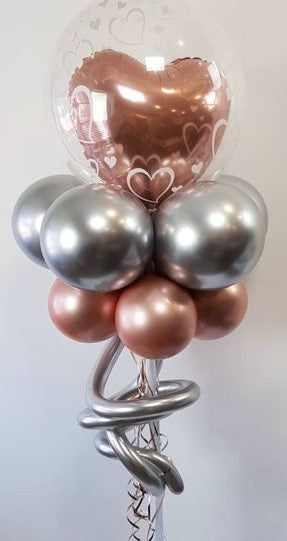 wedding balloon bouquet with heart balloon in bubble and silver chrome balloons, copper chrome balloons in topiary design with silver chrome accent balloons in table top height
